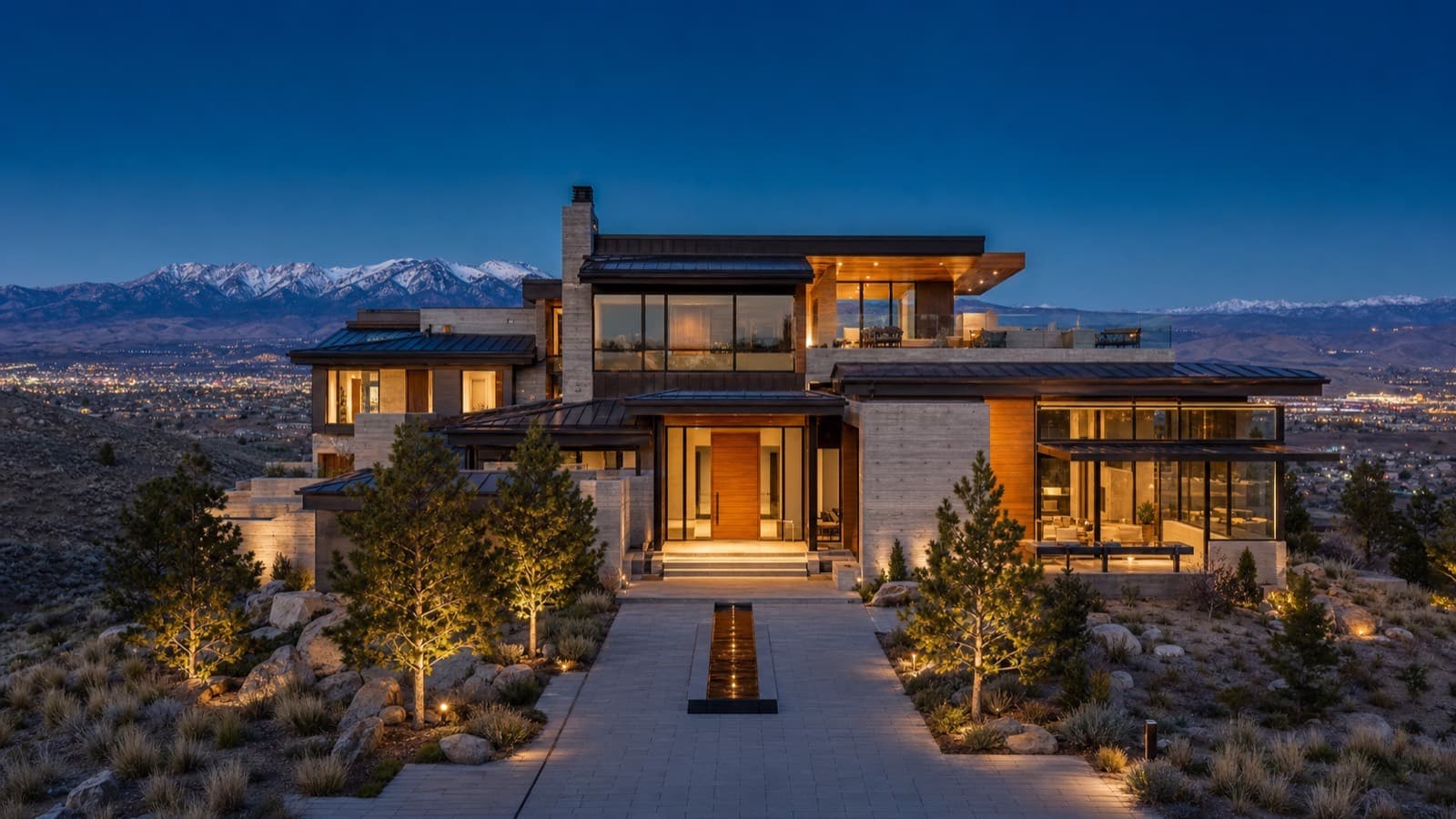 Upscale Reno condominium building with mountain views and resort-style pool deck at sunset